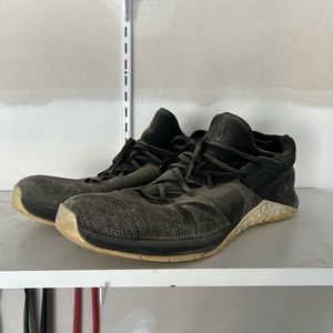 Black and white Nike flynit trainer